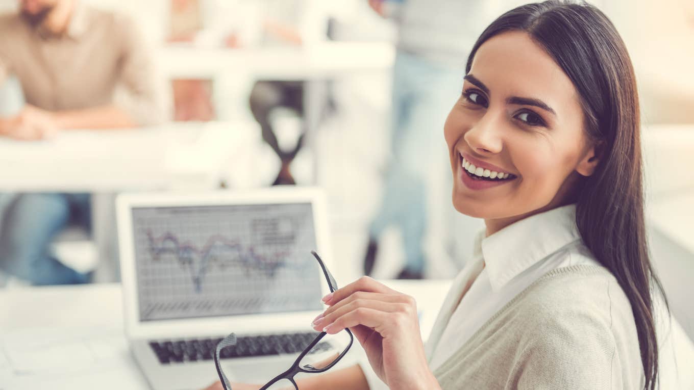 Gen Z worker smiling while working