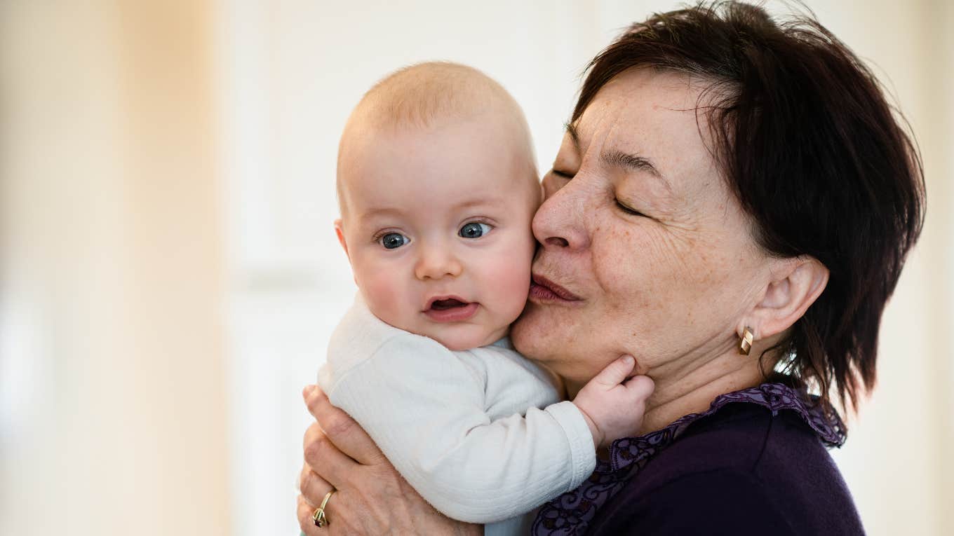 Grandma holding grandchild