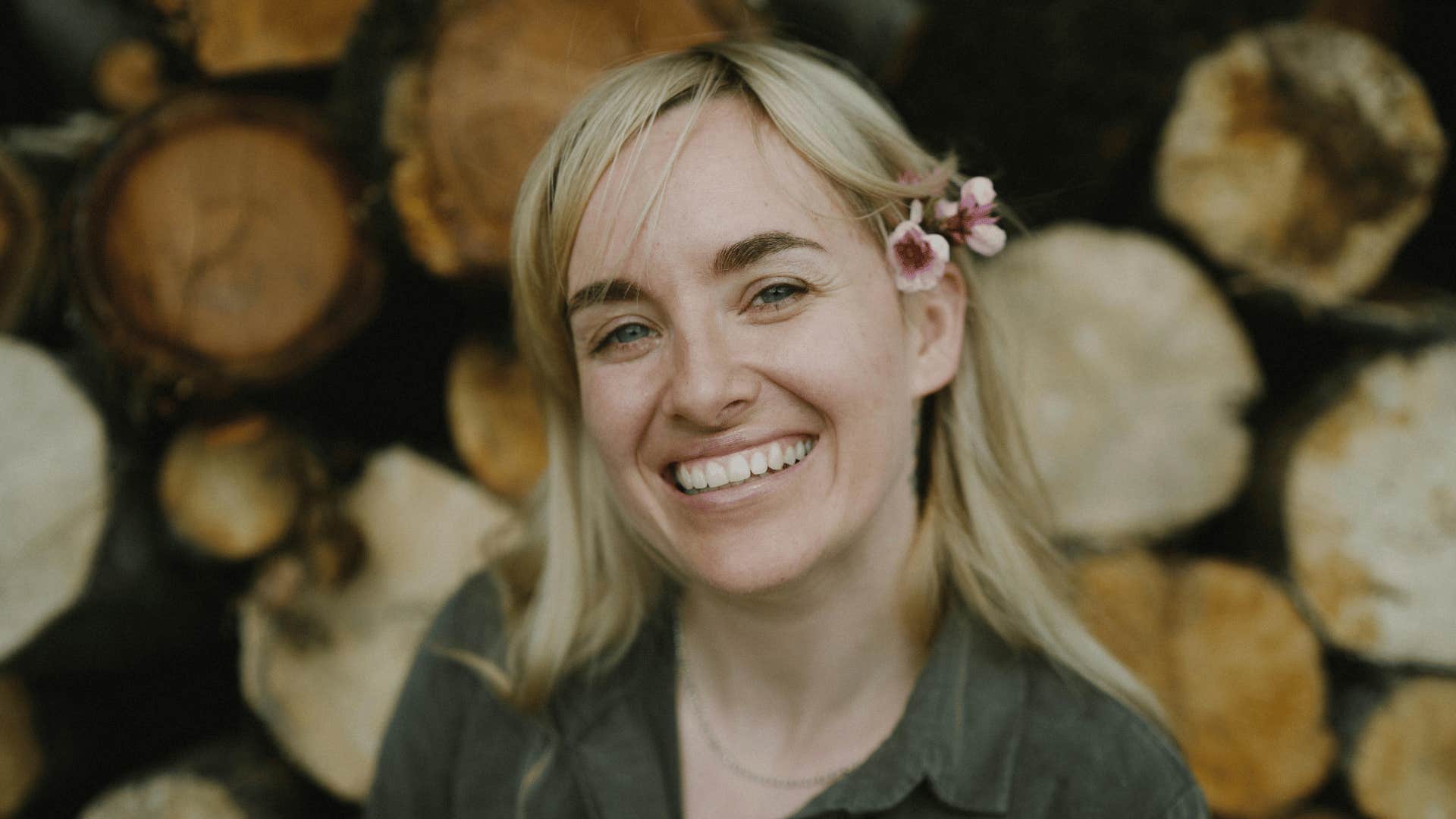 woman smiling with flower in her hair