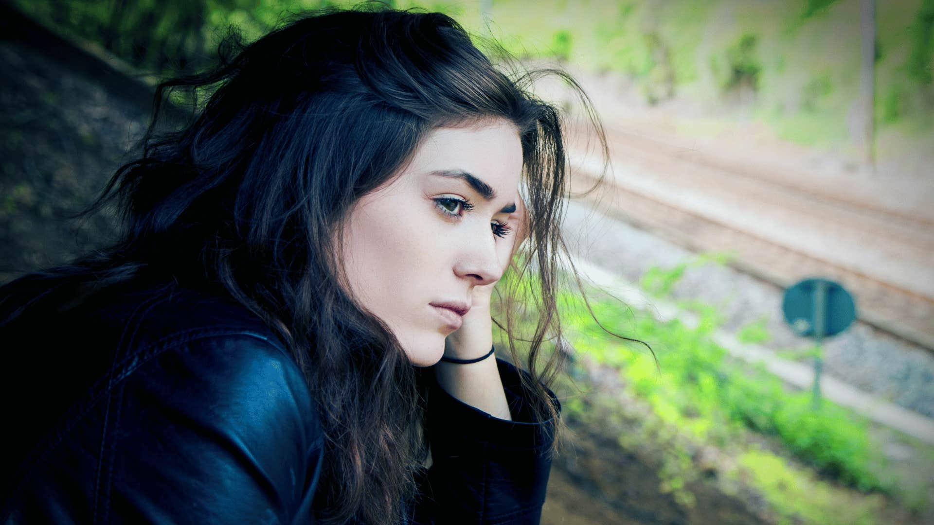 woman staring out the window