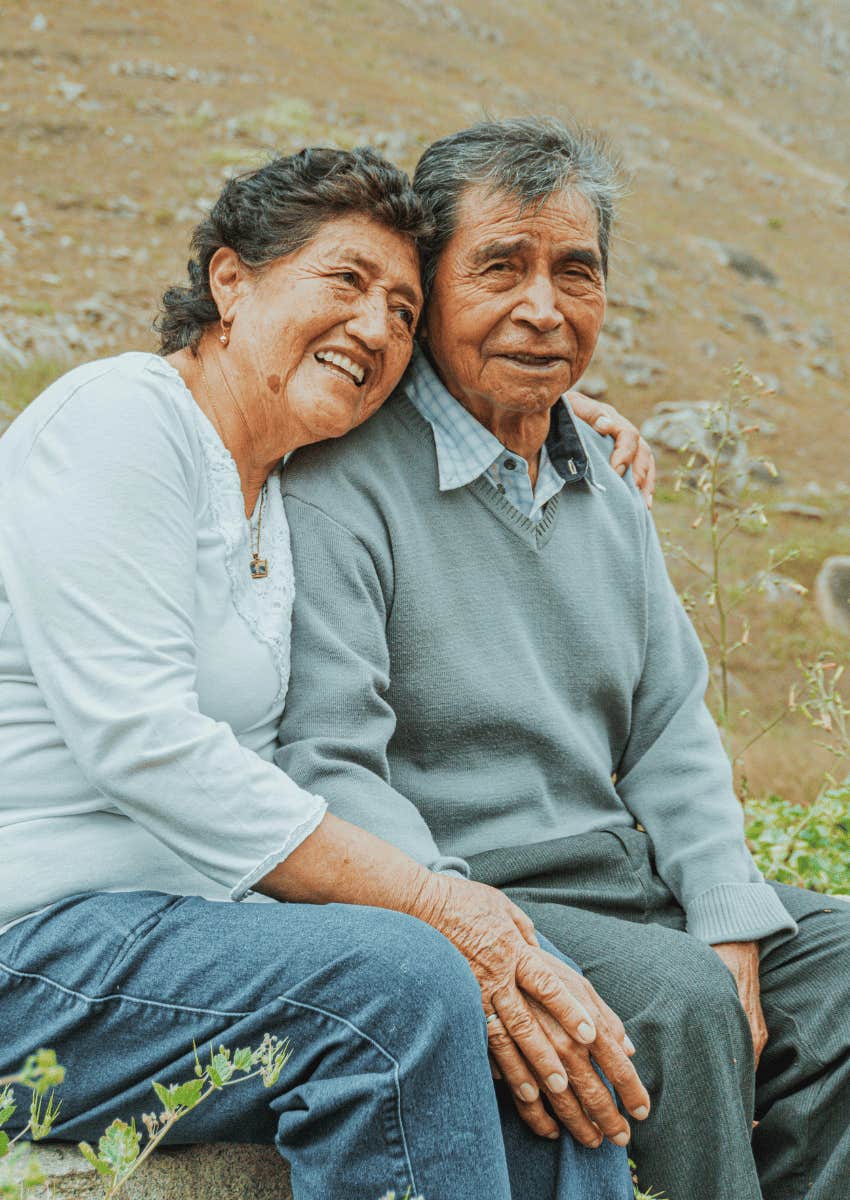 happy elderly couple sitting together