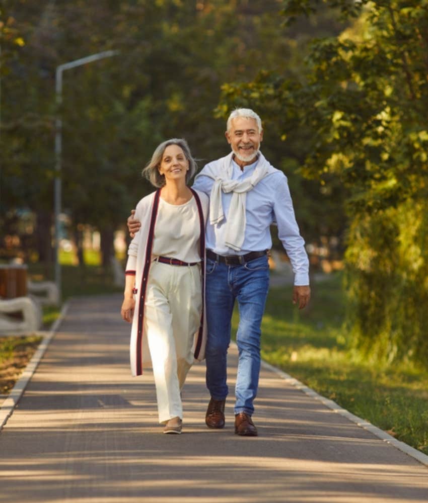 happy elderly couple walking together