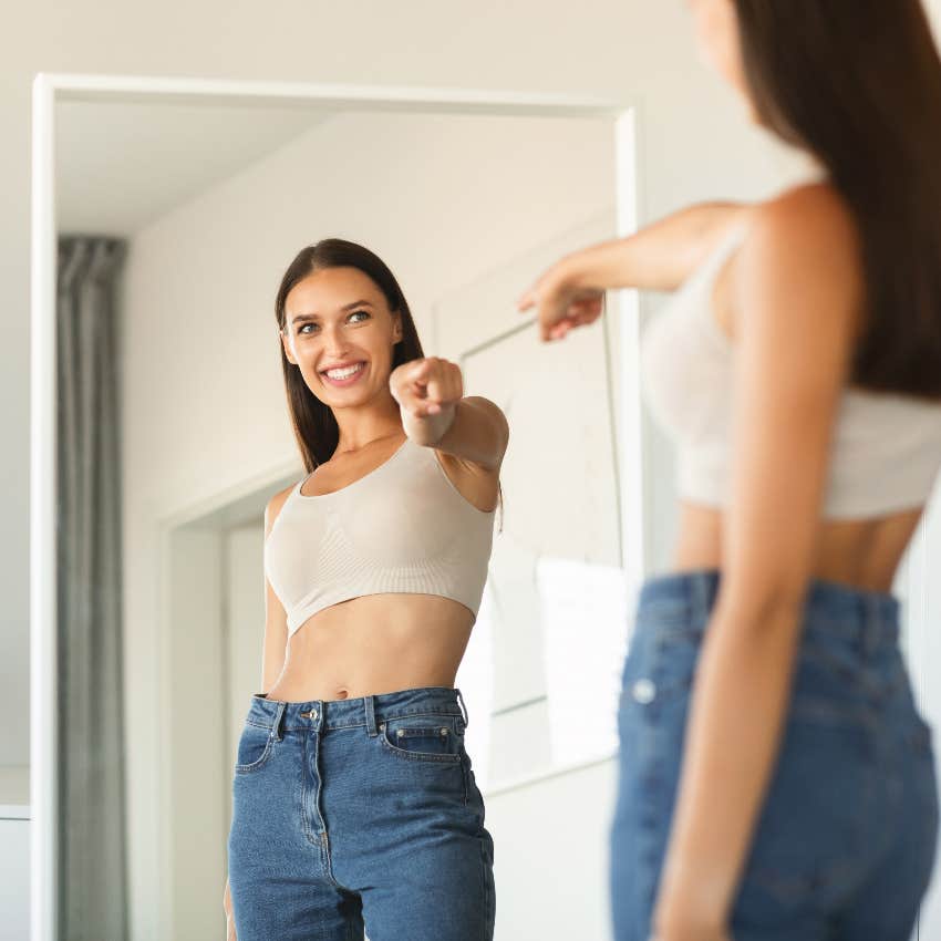 Happy woman practicing morning affirmations