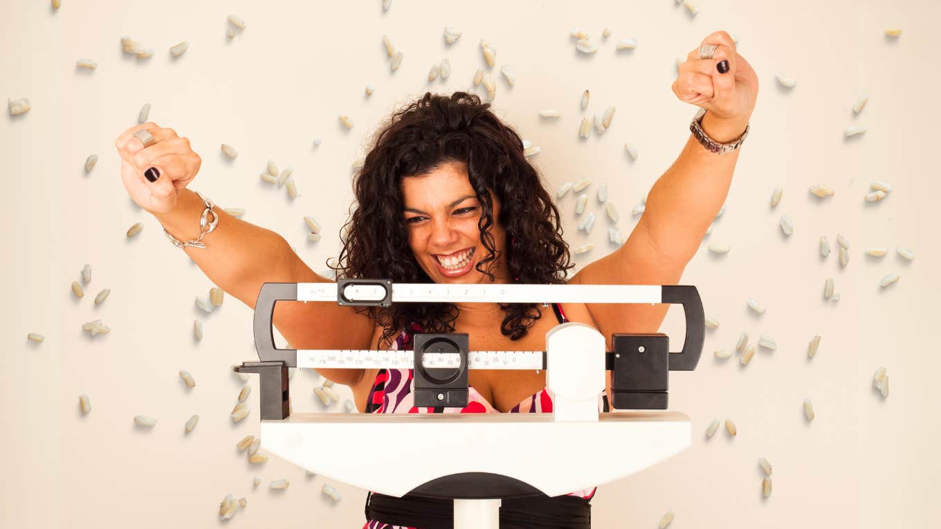 Woman using rice, to aid her weight loss