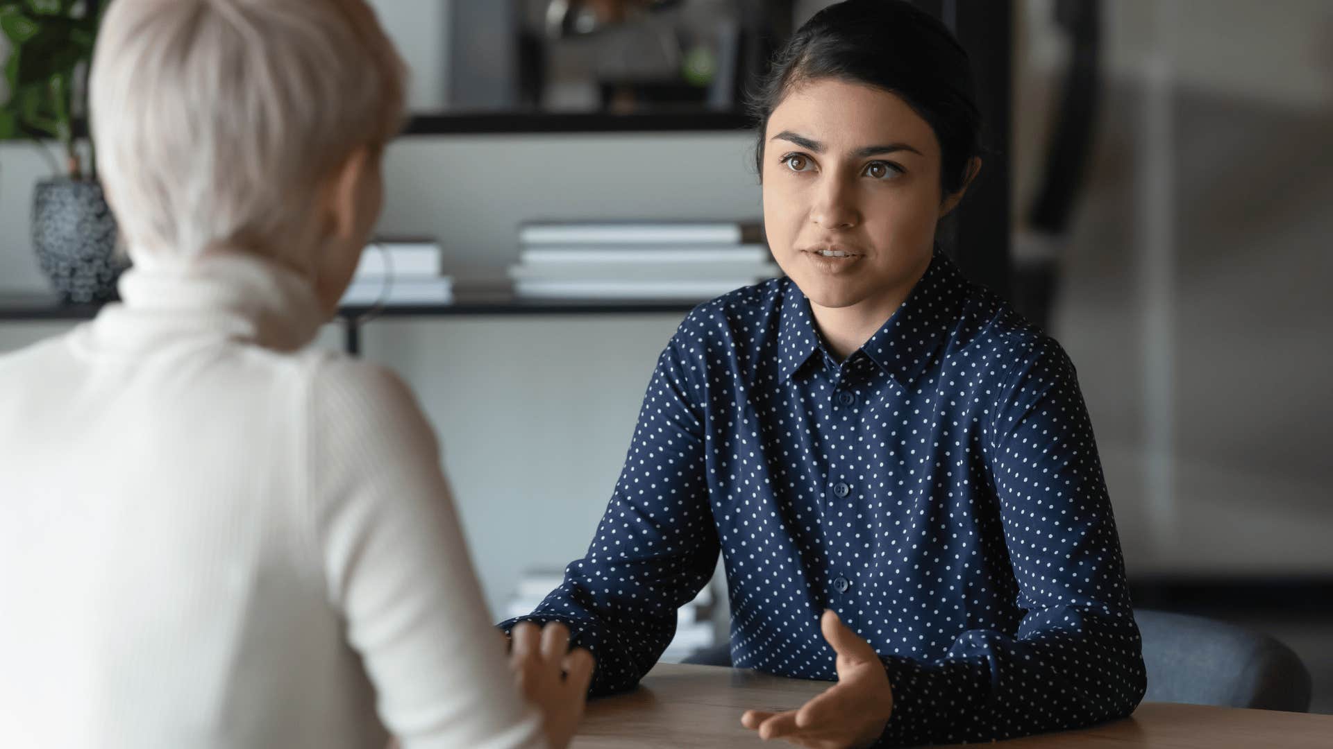 woman at job explaining something to boss