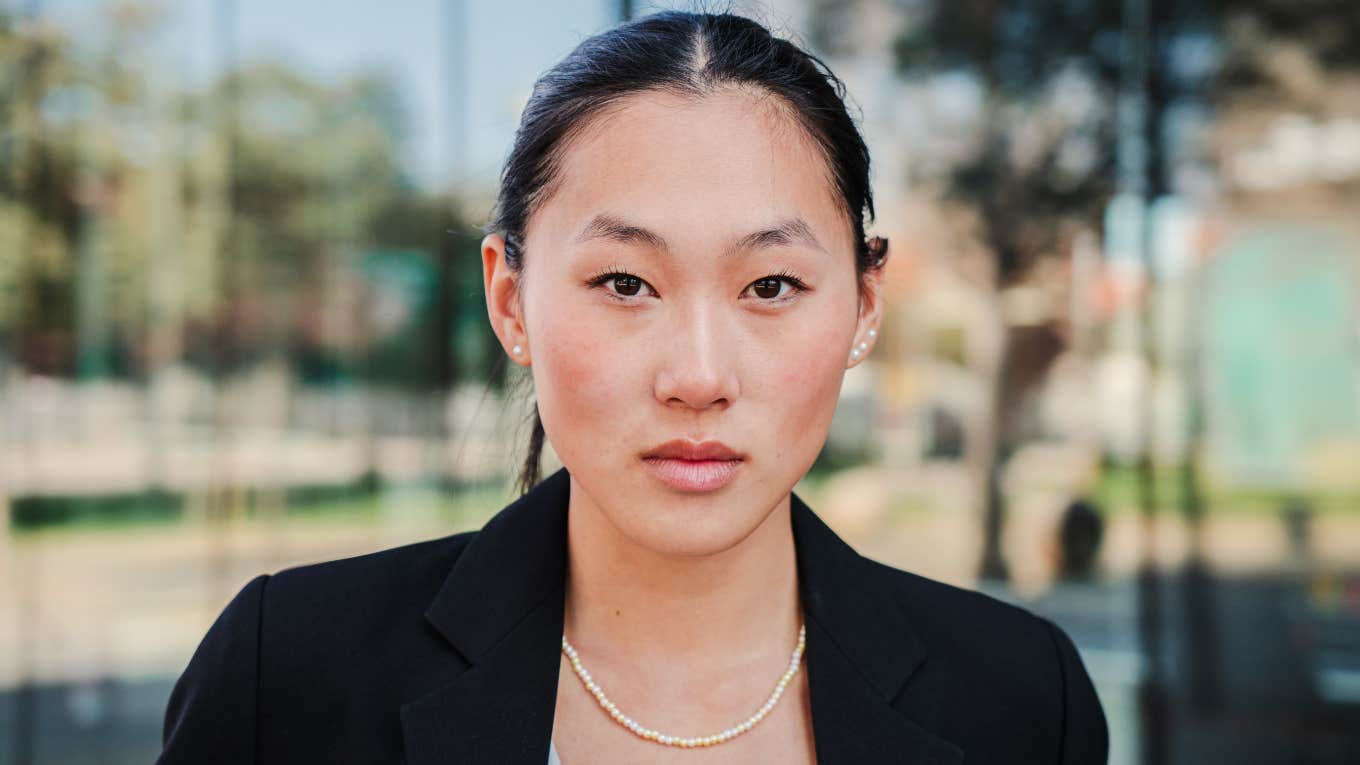 serious employee pondering her workplace choices