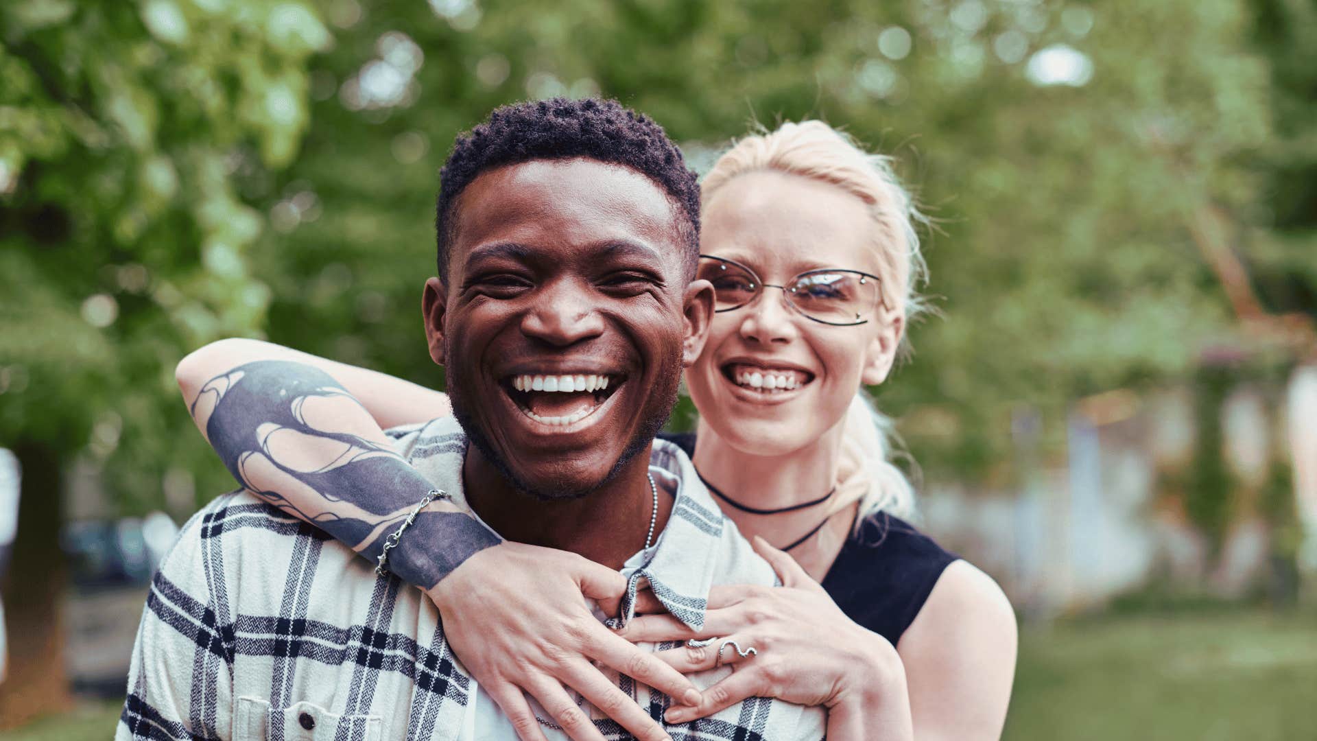 Biracial couple happily together, enjoying the outdoors