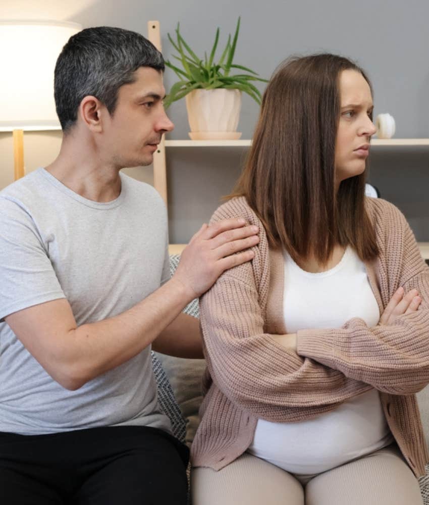 Husband comforts angry pregnant wife