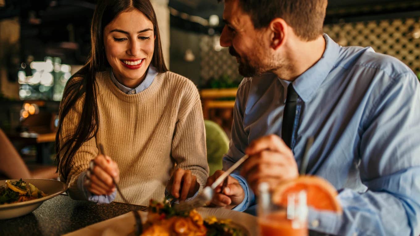 Husband and wife eating together at a restaurant