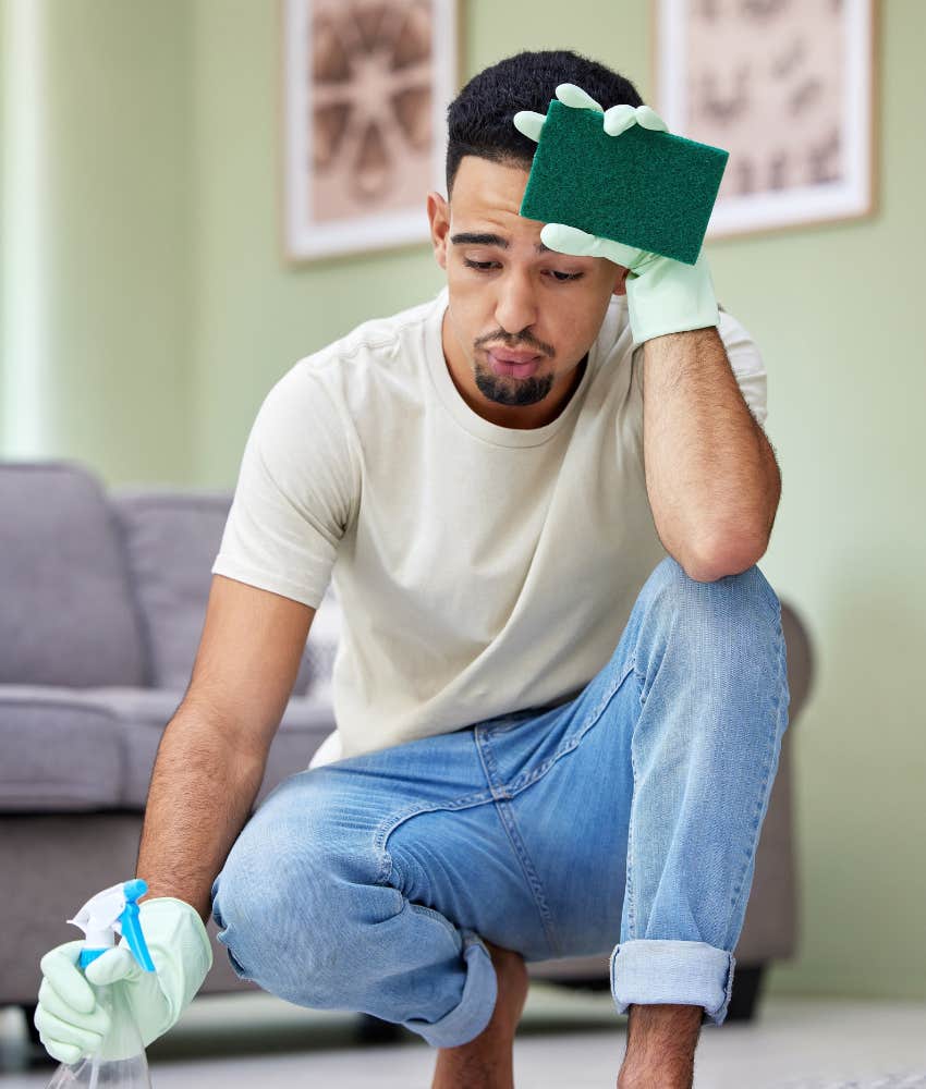 husband feeling exhausted and overwhelmed by cleaning