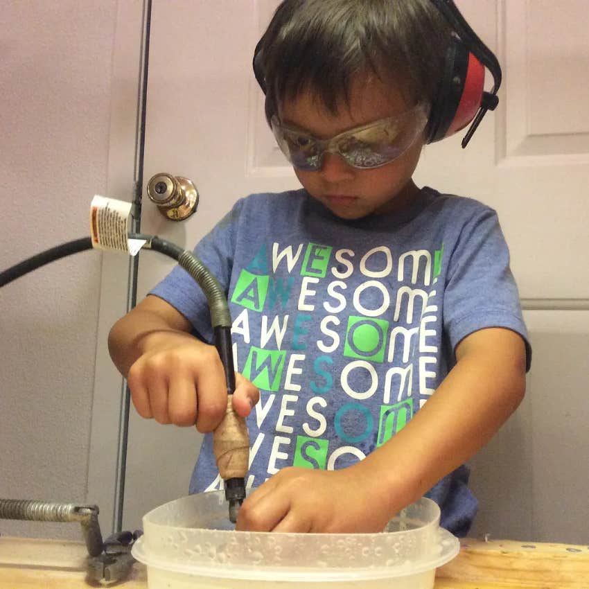 Kid using tools in homemade cave