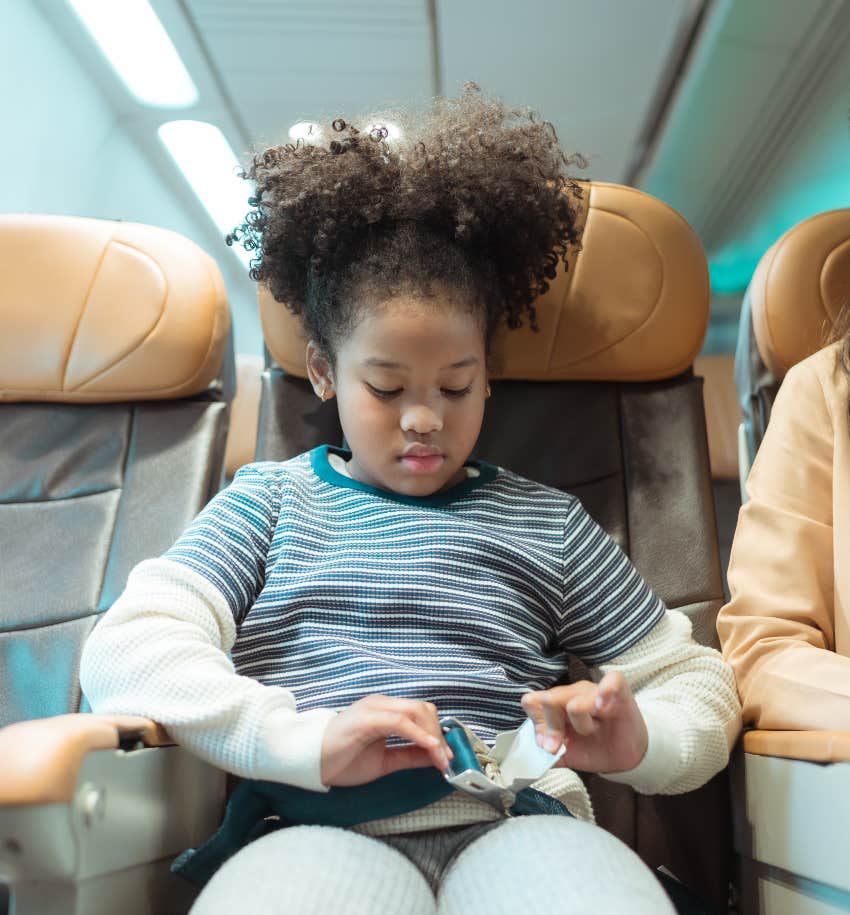 Kid in window seat on a flight