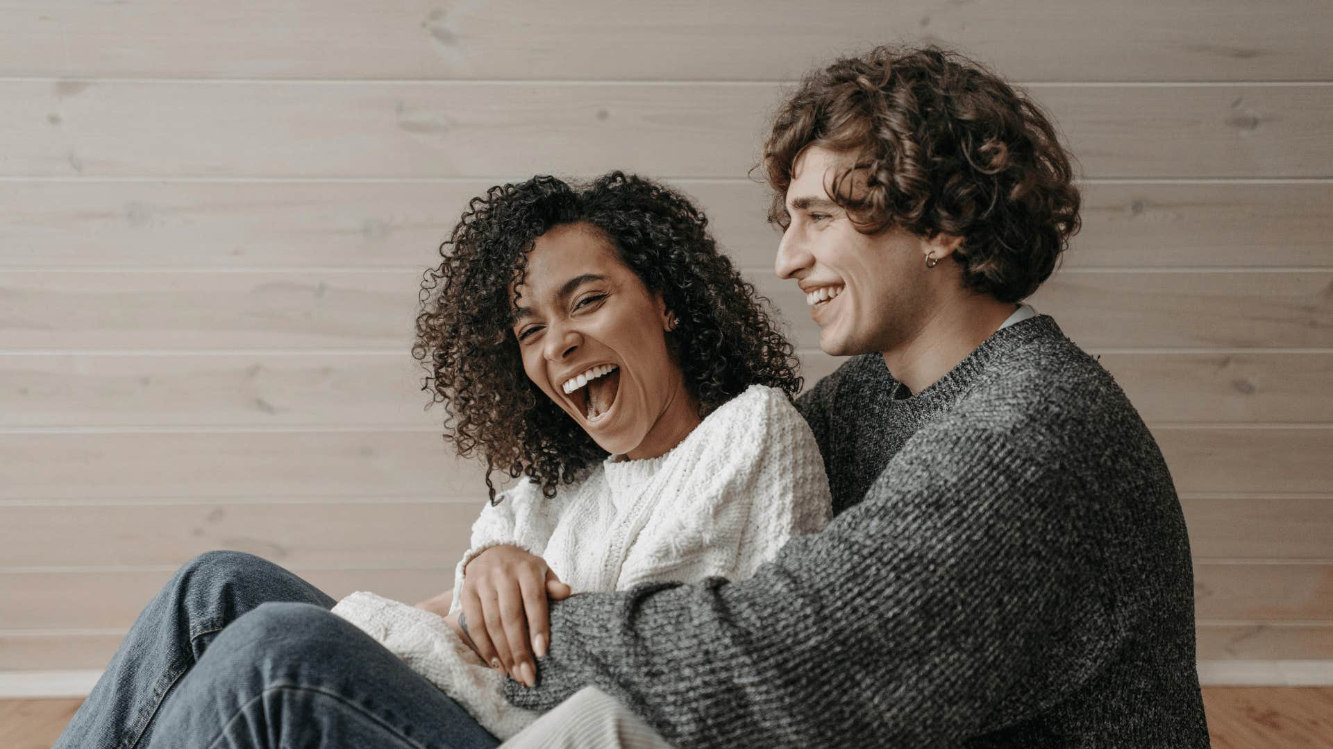 laughing couple embracing