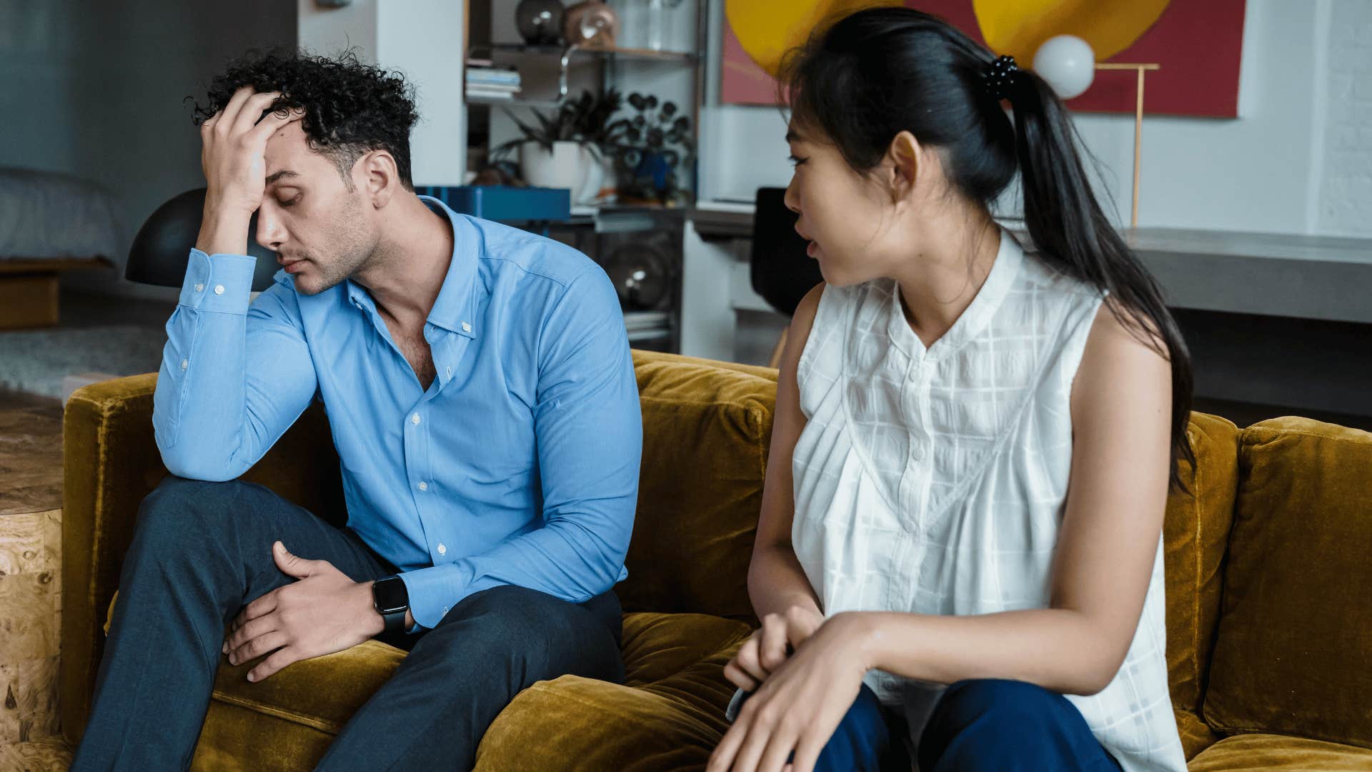 man looking upset while woman looks concerned