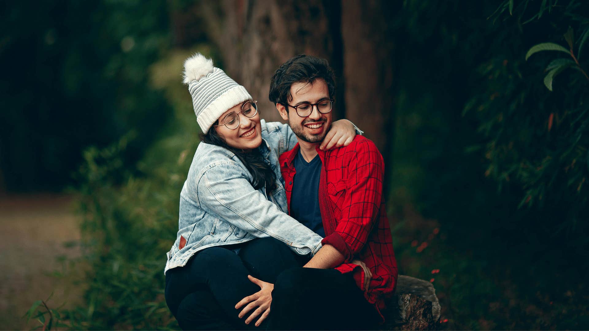 man and woman hugging happily