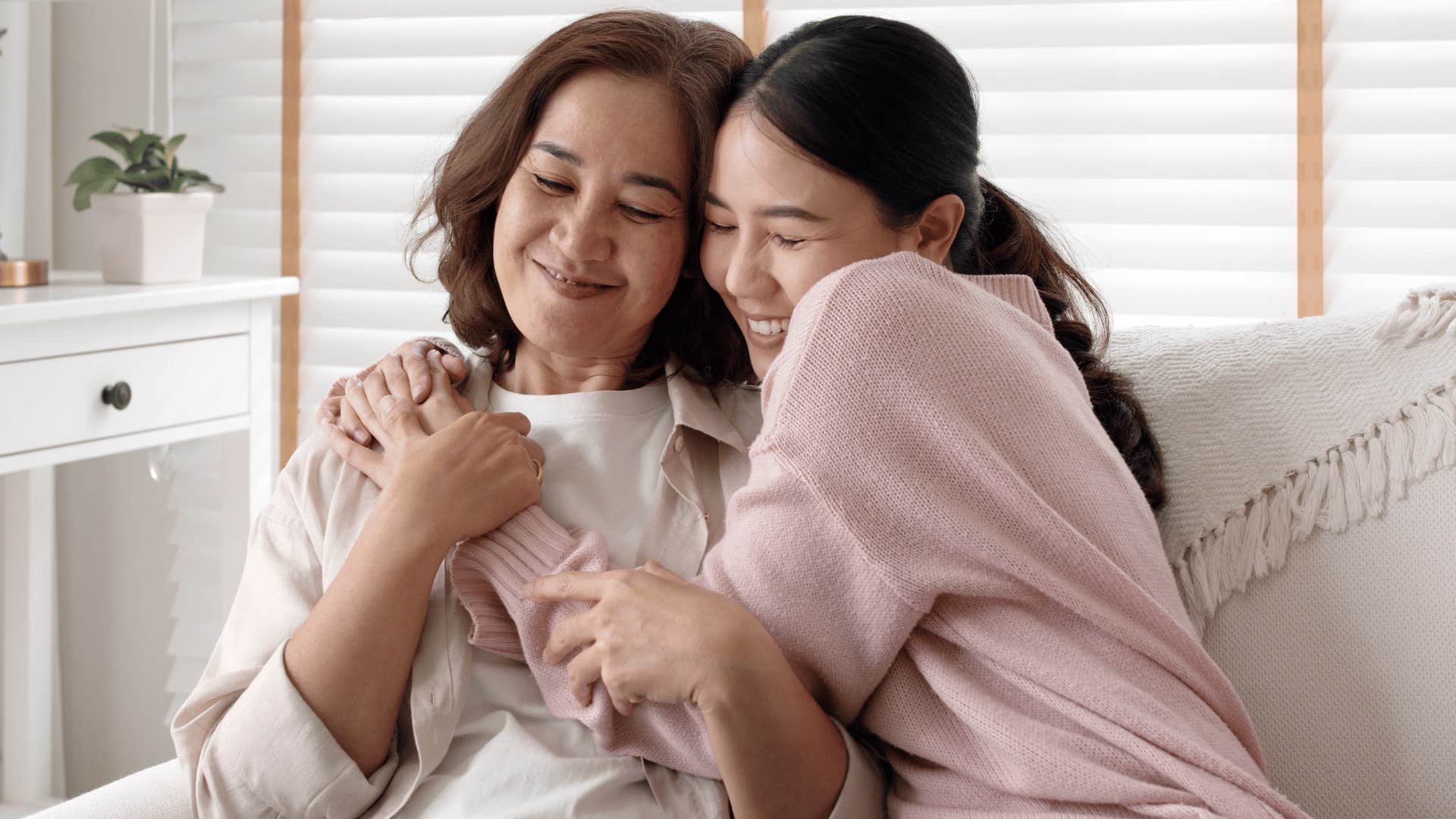 daughter hugging mom 