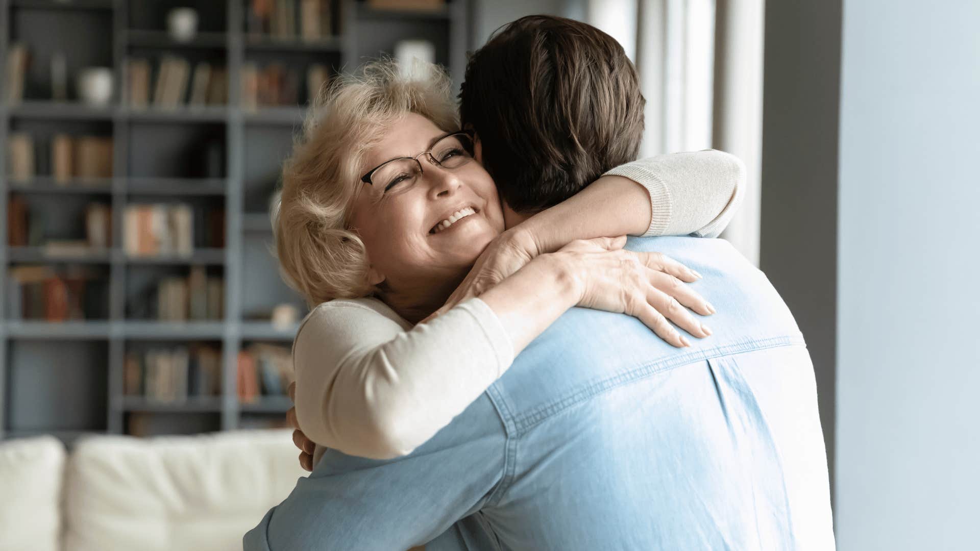 woman hugging son