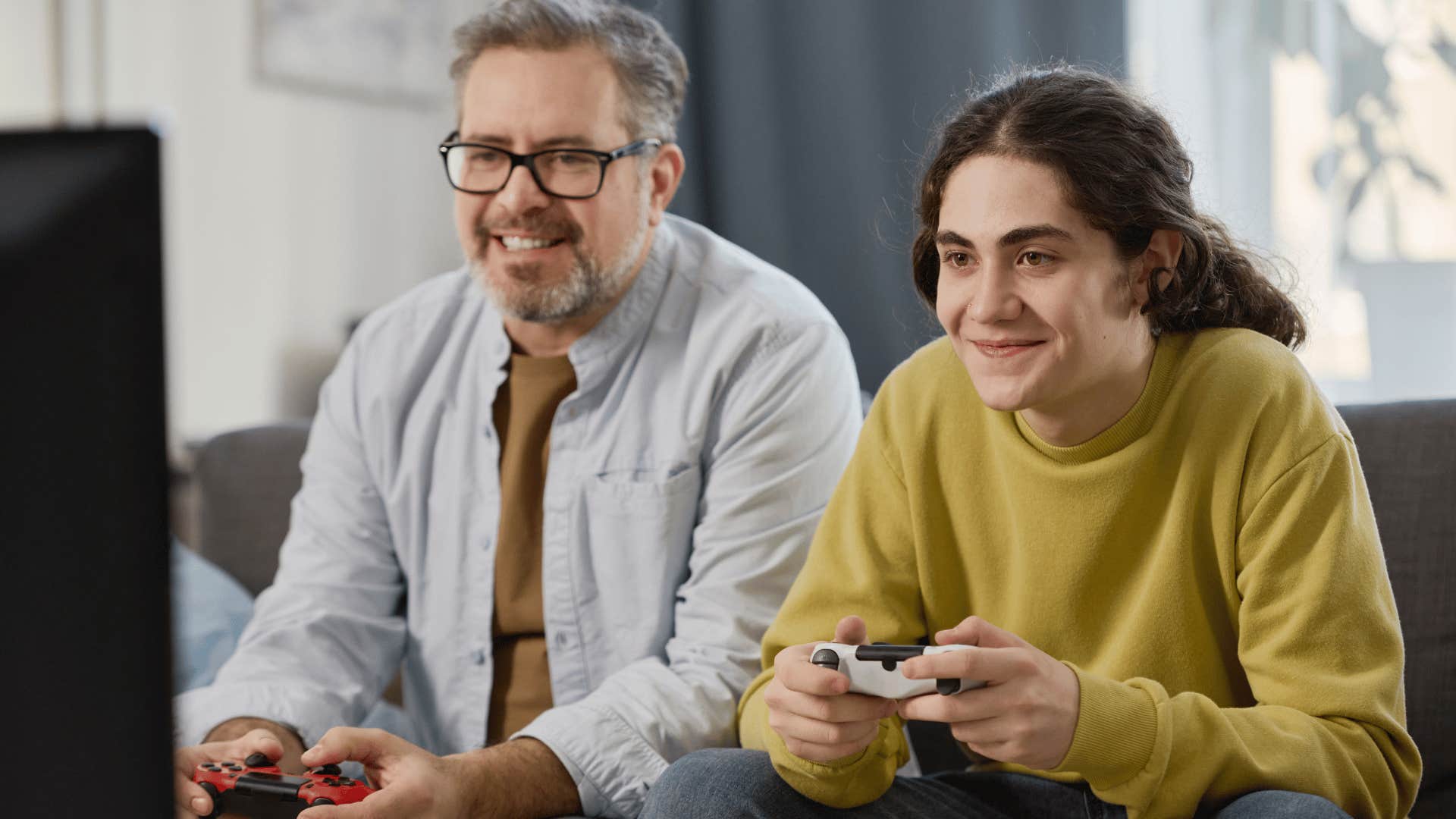 son playing video game with dad