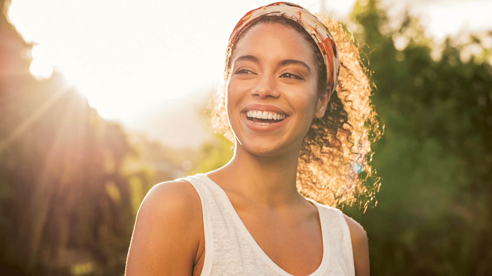 woman smiling looking to her side