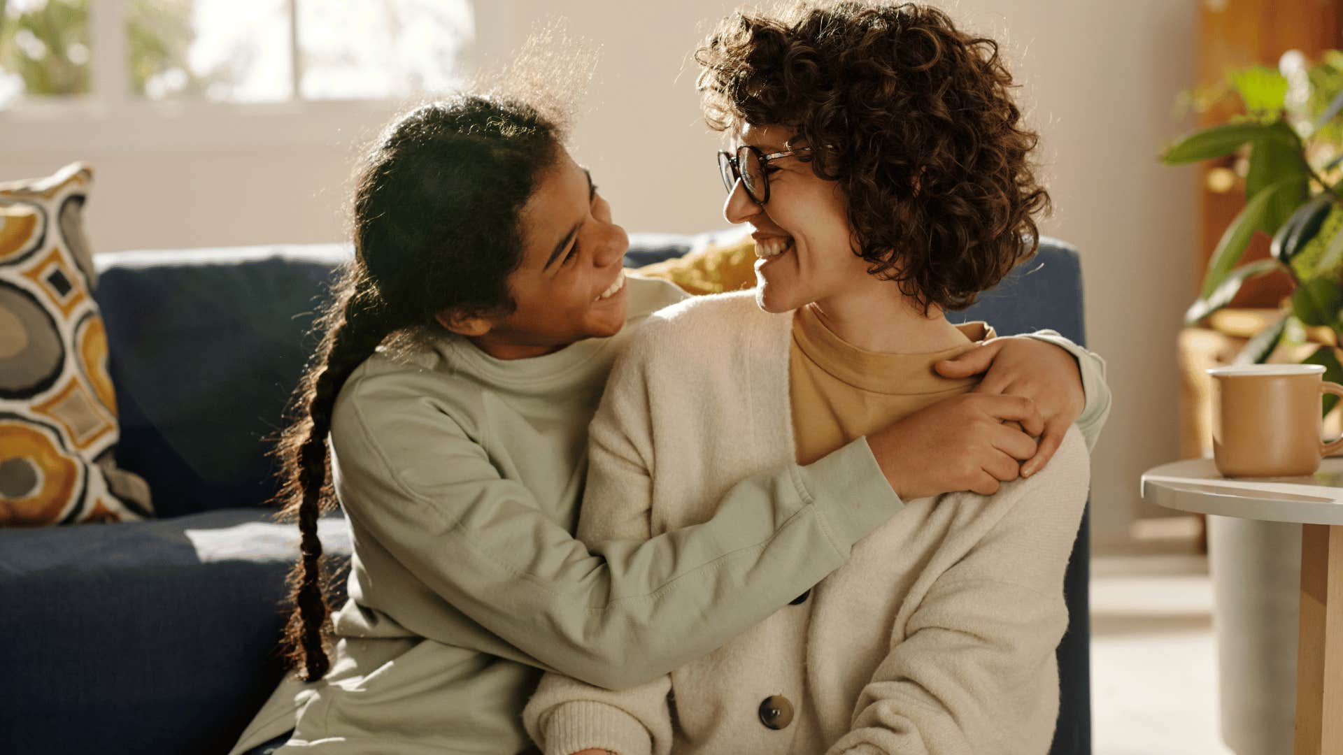 young lady hugging mom 