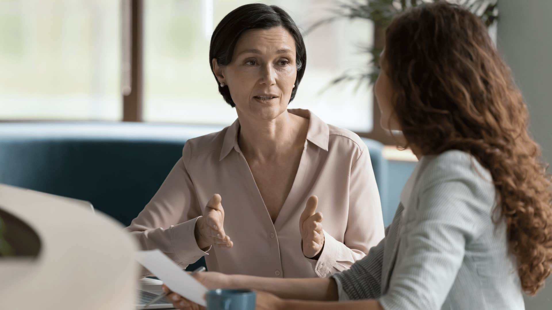 woman explaining something to another woman