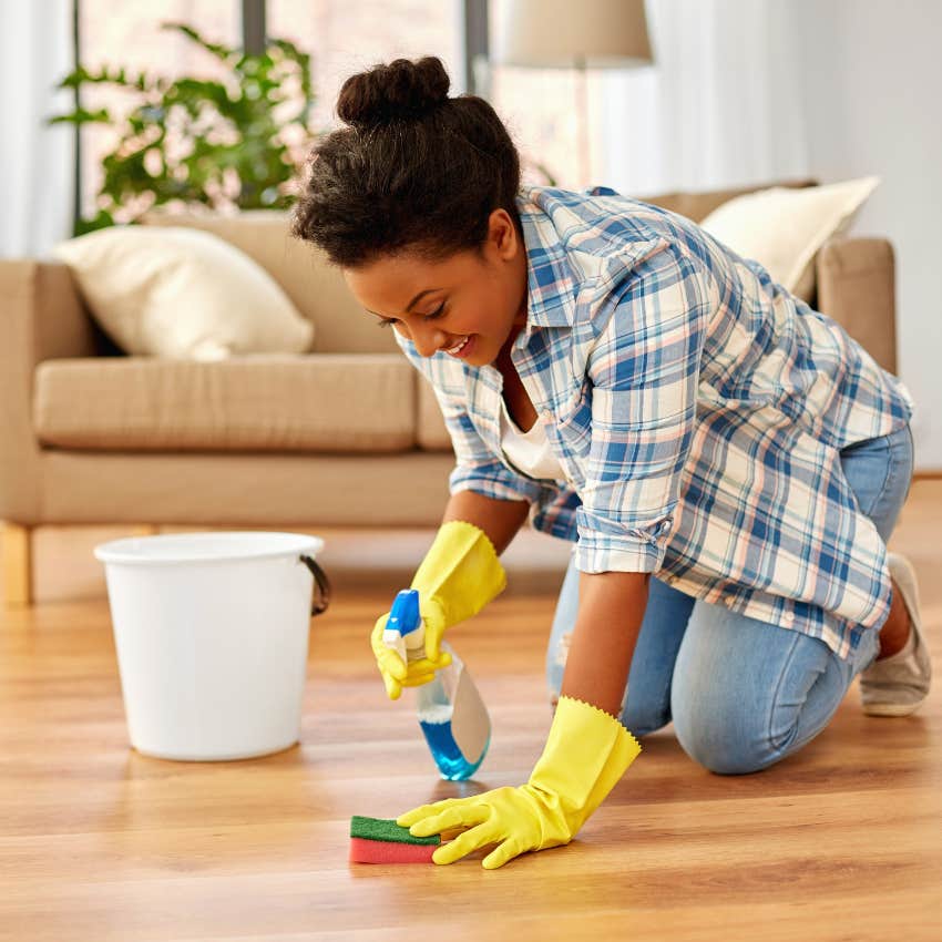 cleaning a floor with glass cleaner