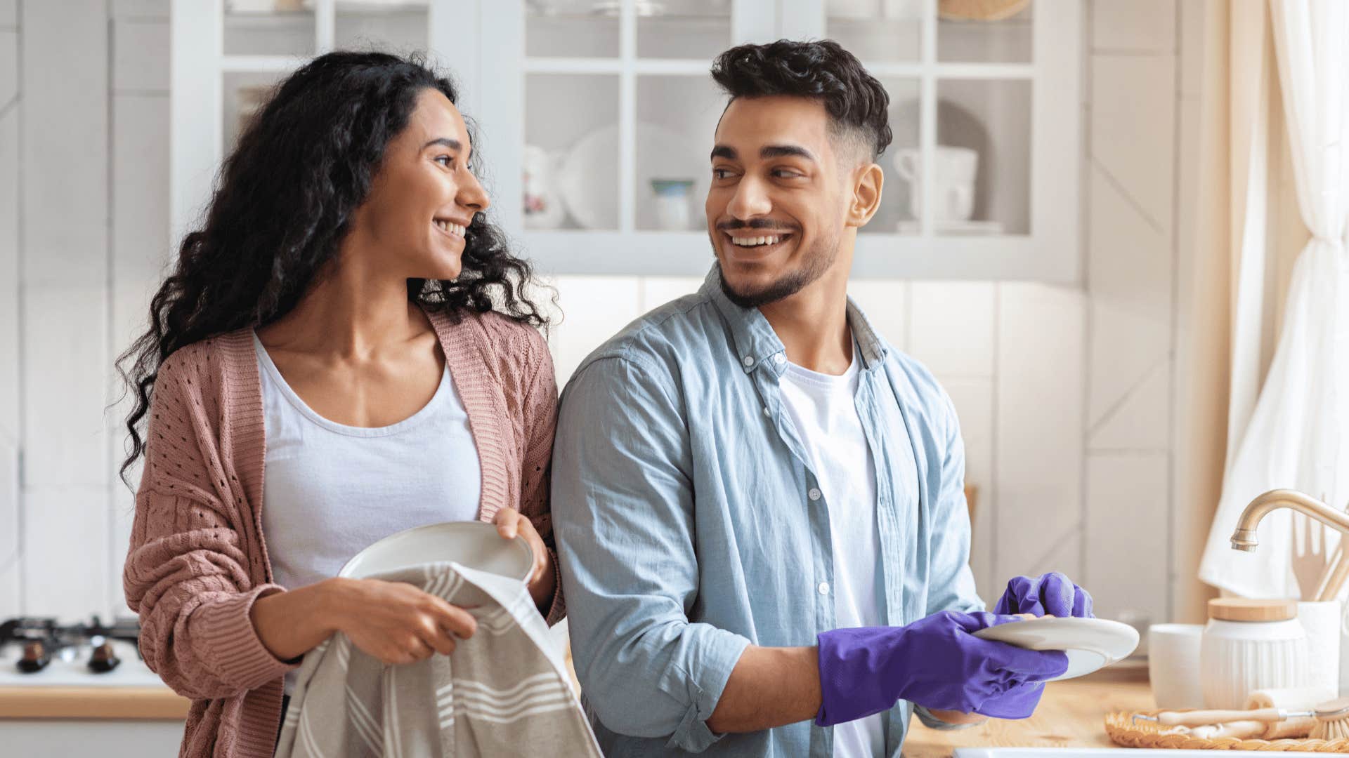 man and woman doing dishes