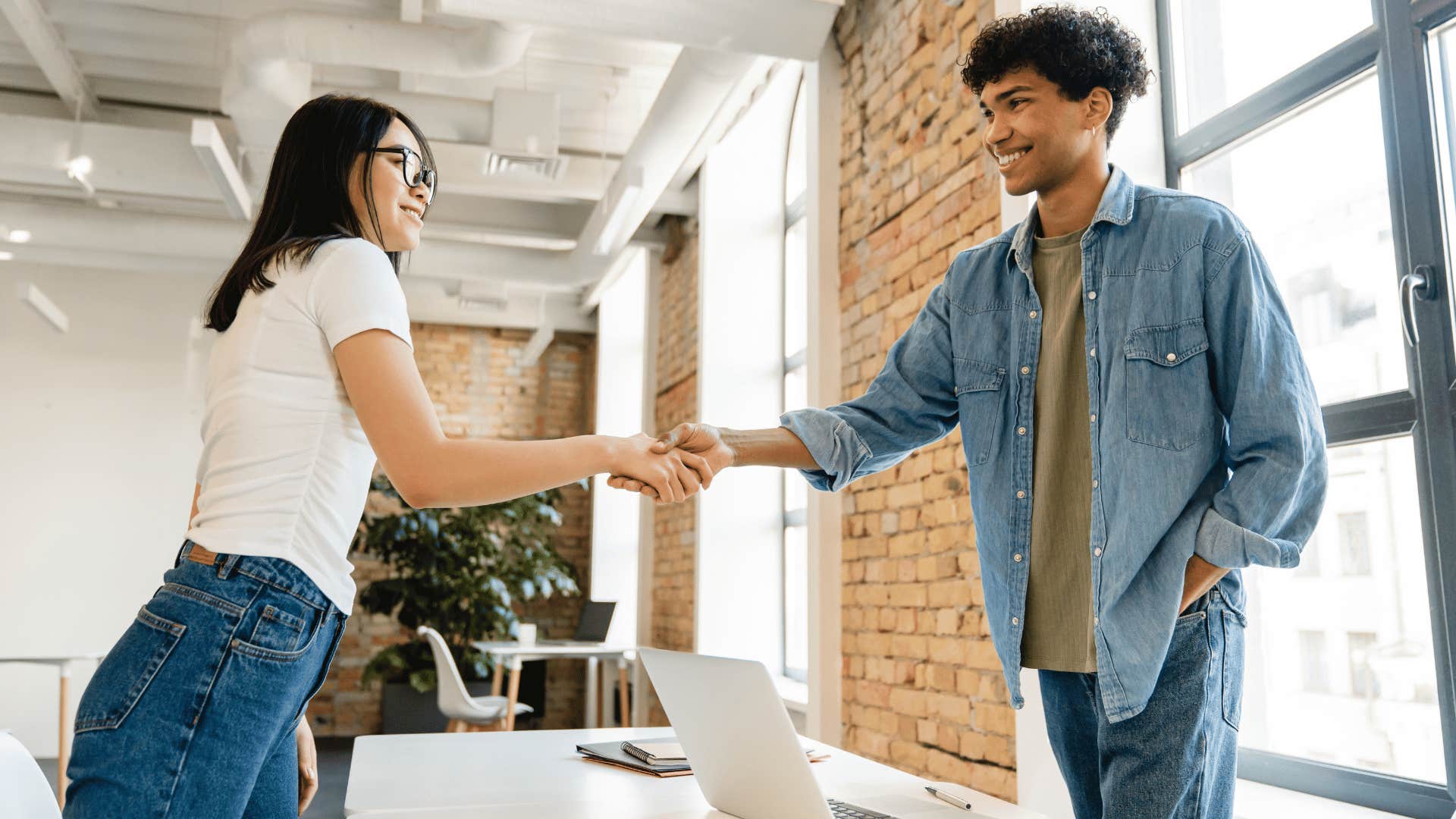 man and woman shaking hands