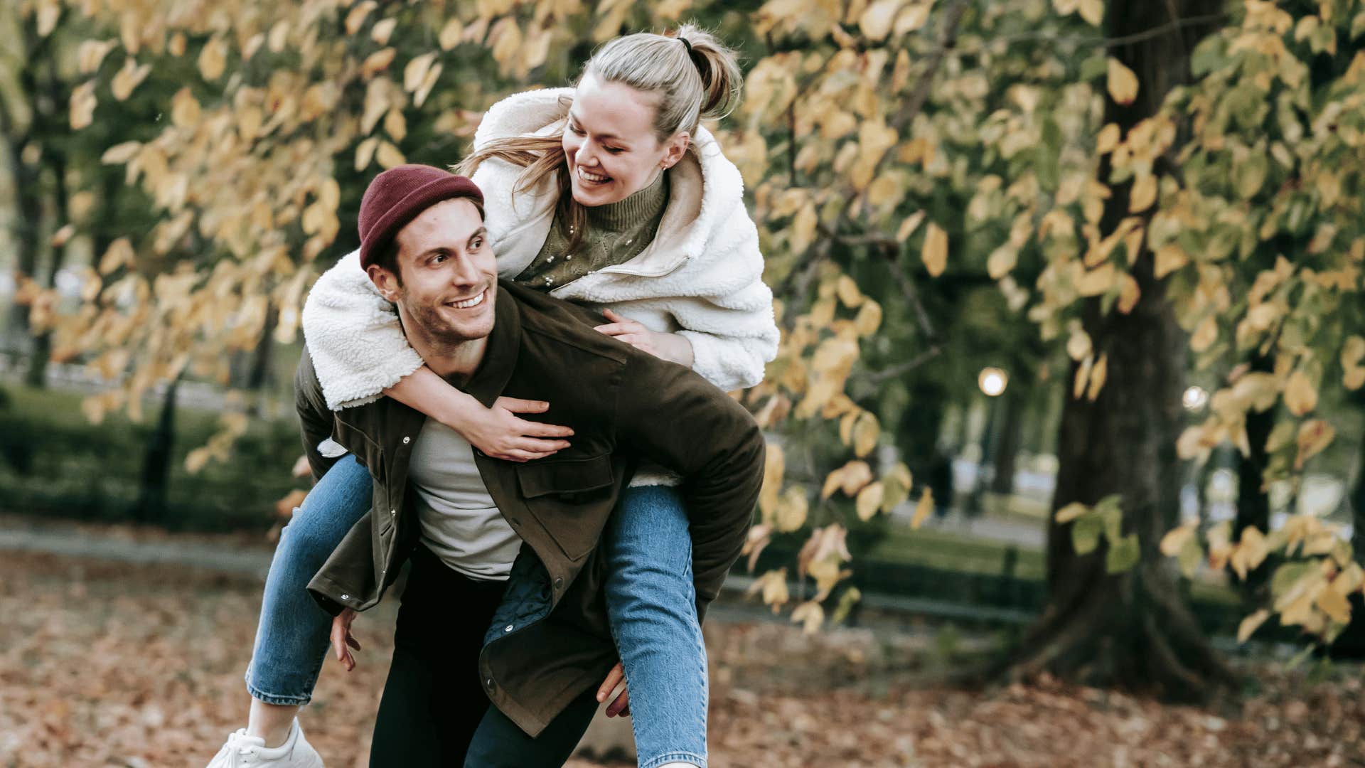 man giving woman piggyback ride