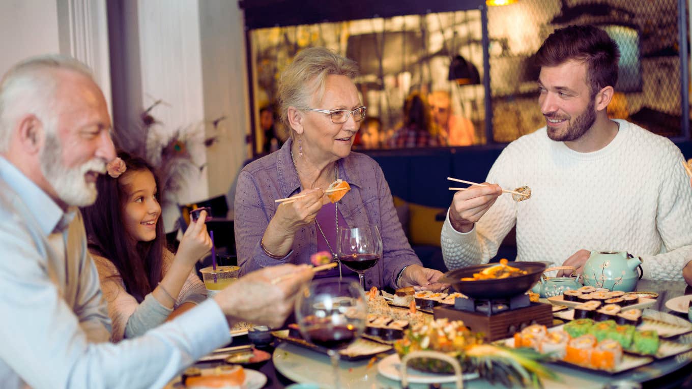 family at sushi restaurant celebrating grandmother's birthday