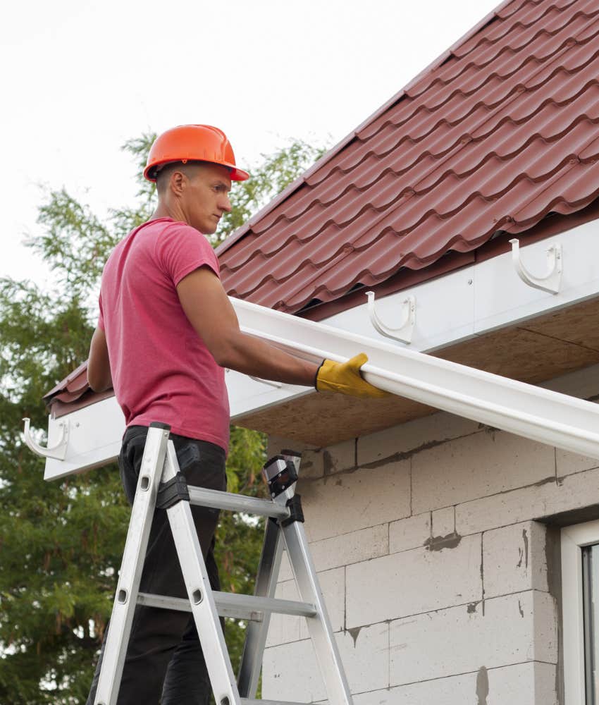 Man installing gutter