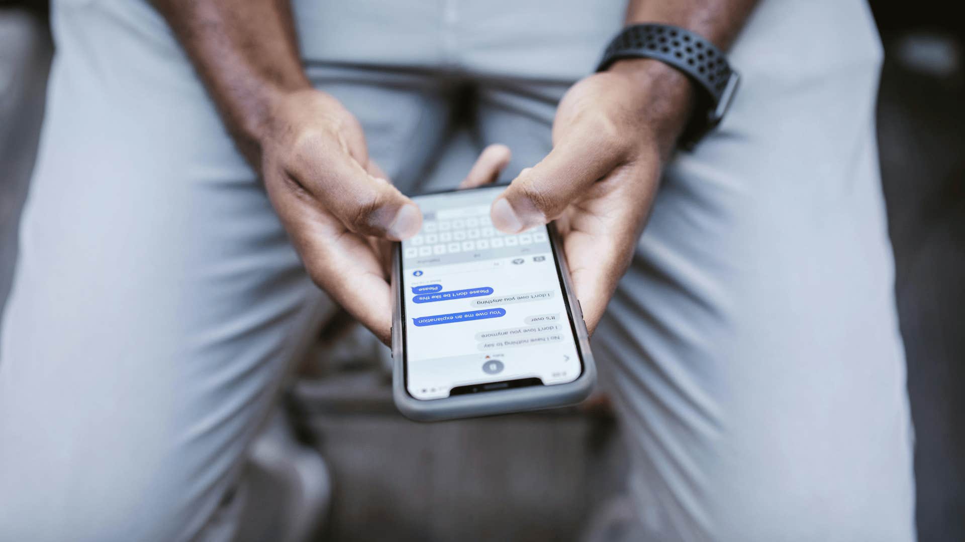 man looking at message thread