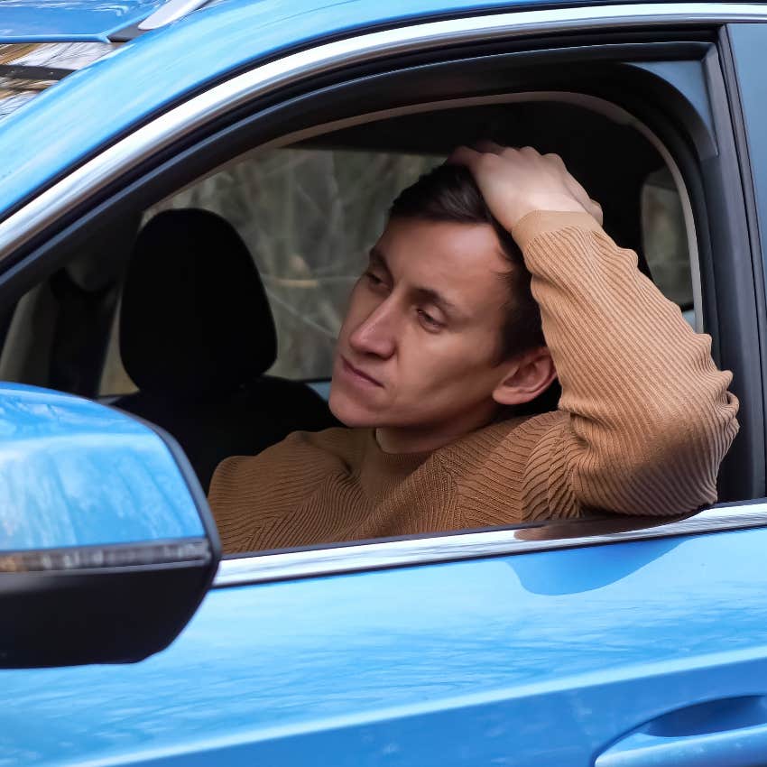 husband sitting in car during a family emergency