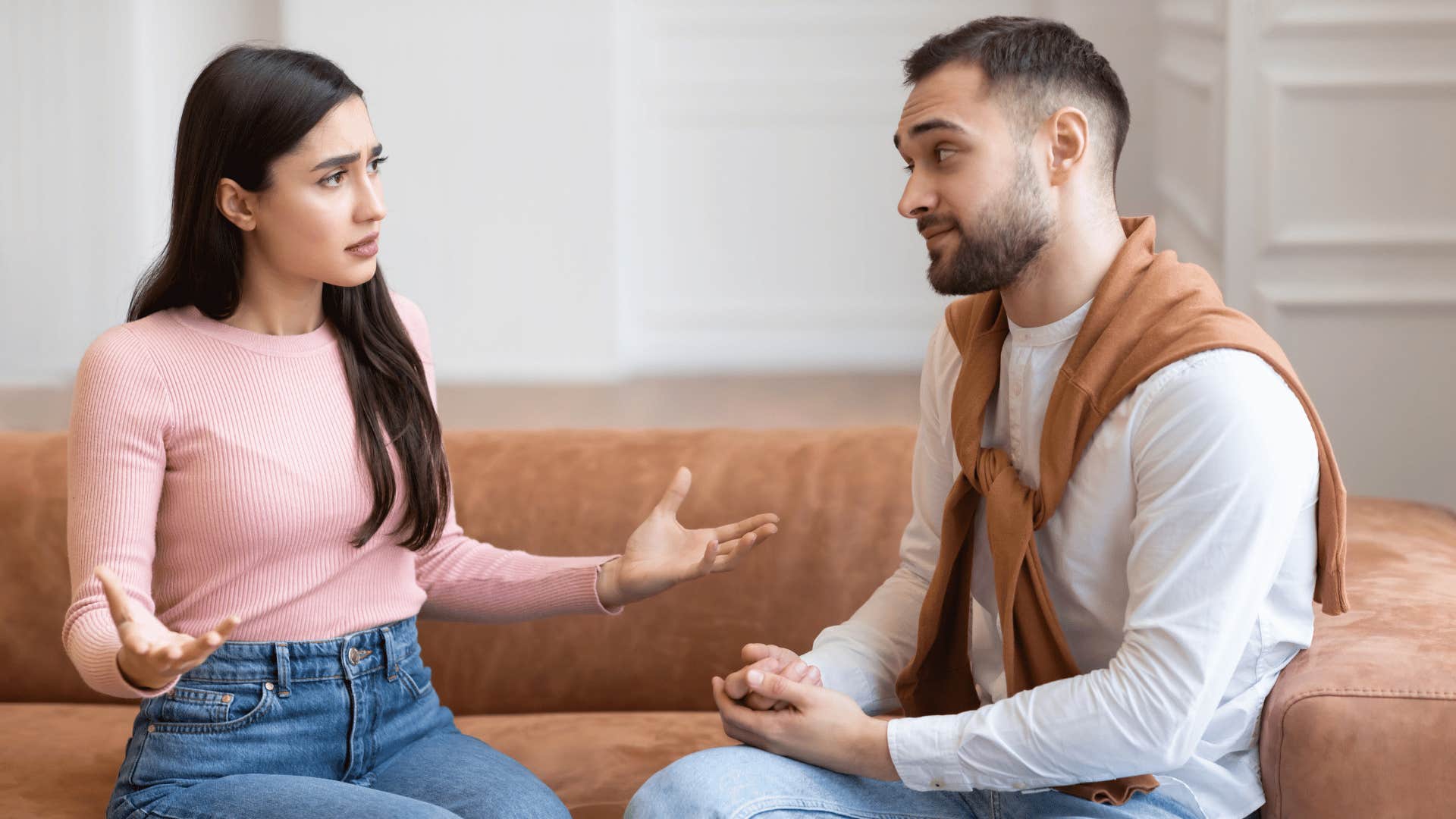 couple arguing on couch