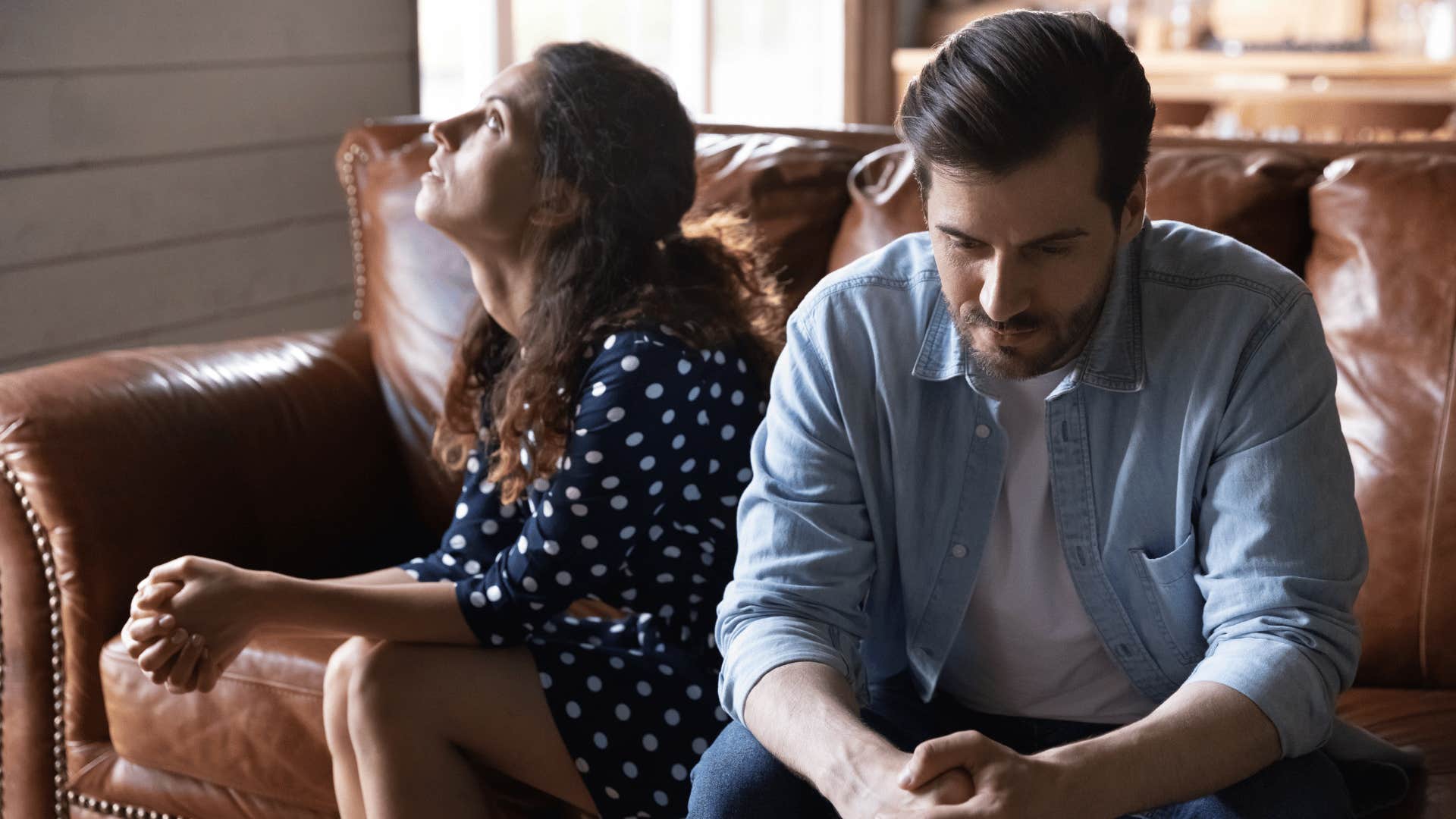 frustrated couple sitting together