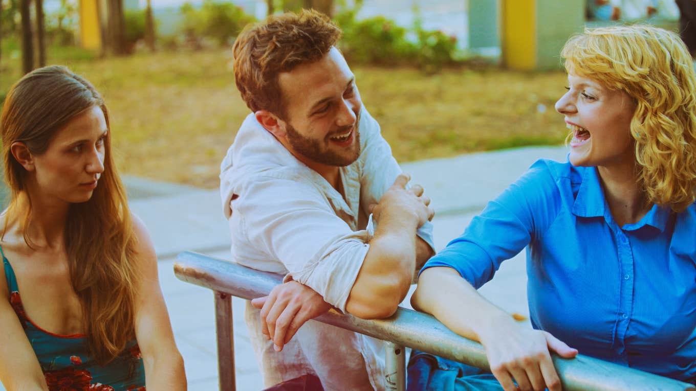 Man checks out other women in front of partner.