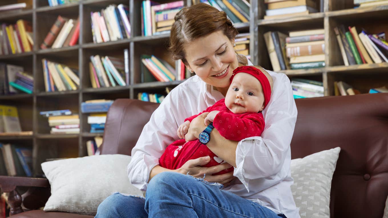 mom holding her baby in a library