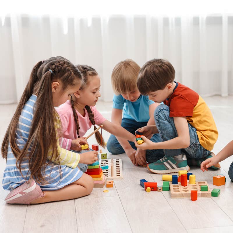 kids playing with toys together on the floor