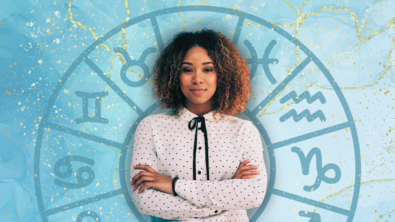 ambitious woman in front of zodiac wheel