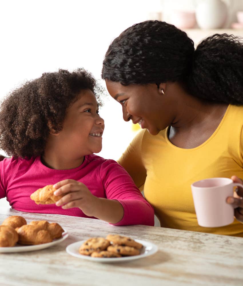 loving mother and daughter sharing breakfast together