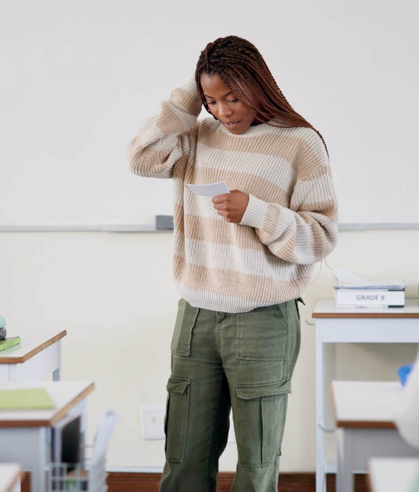 Nervous female student giving presentation in class