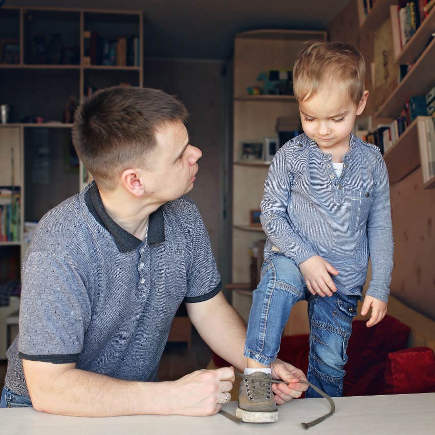 Parent teaching their child to tie their shoes