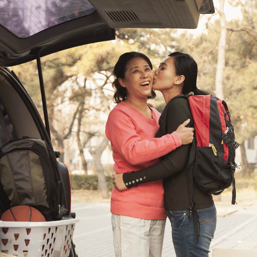 daughter kissing her mom goodbye