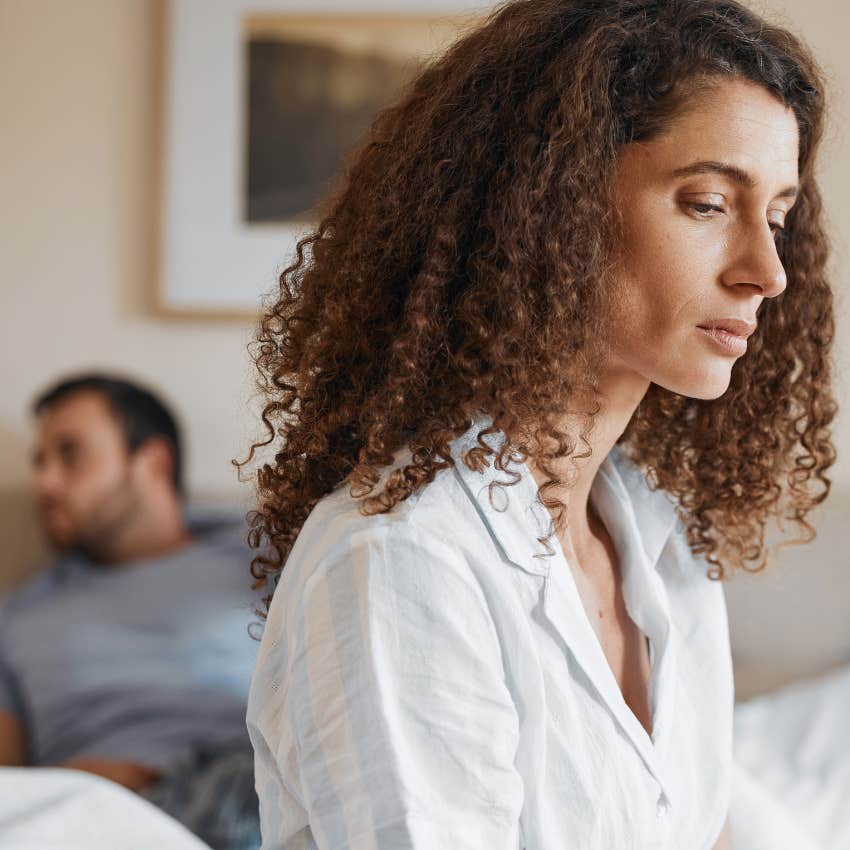 Pregnant girlfriend looking angry at man. 