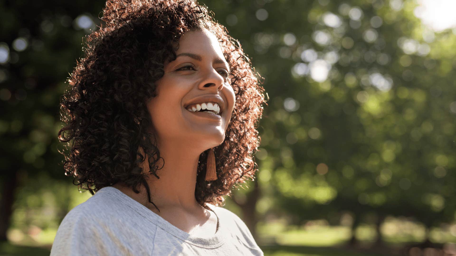 woman smiling while being outside 