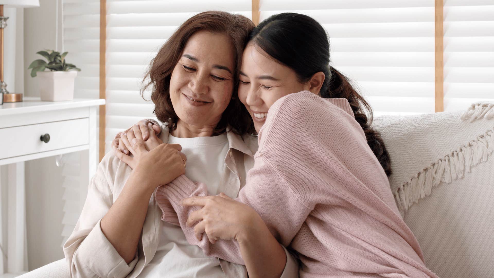 mom and daughter hugging in rare instance 