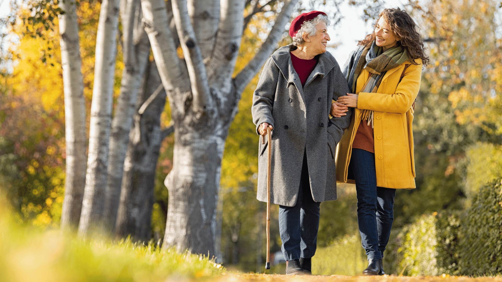 older woman walking with younger woman