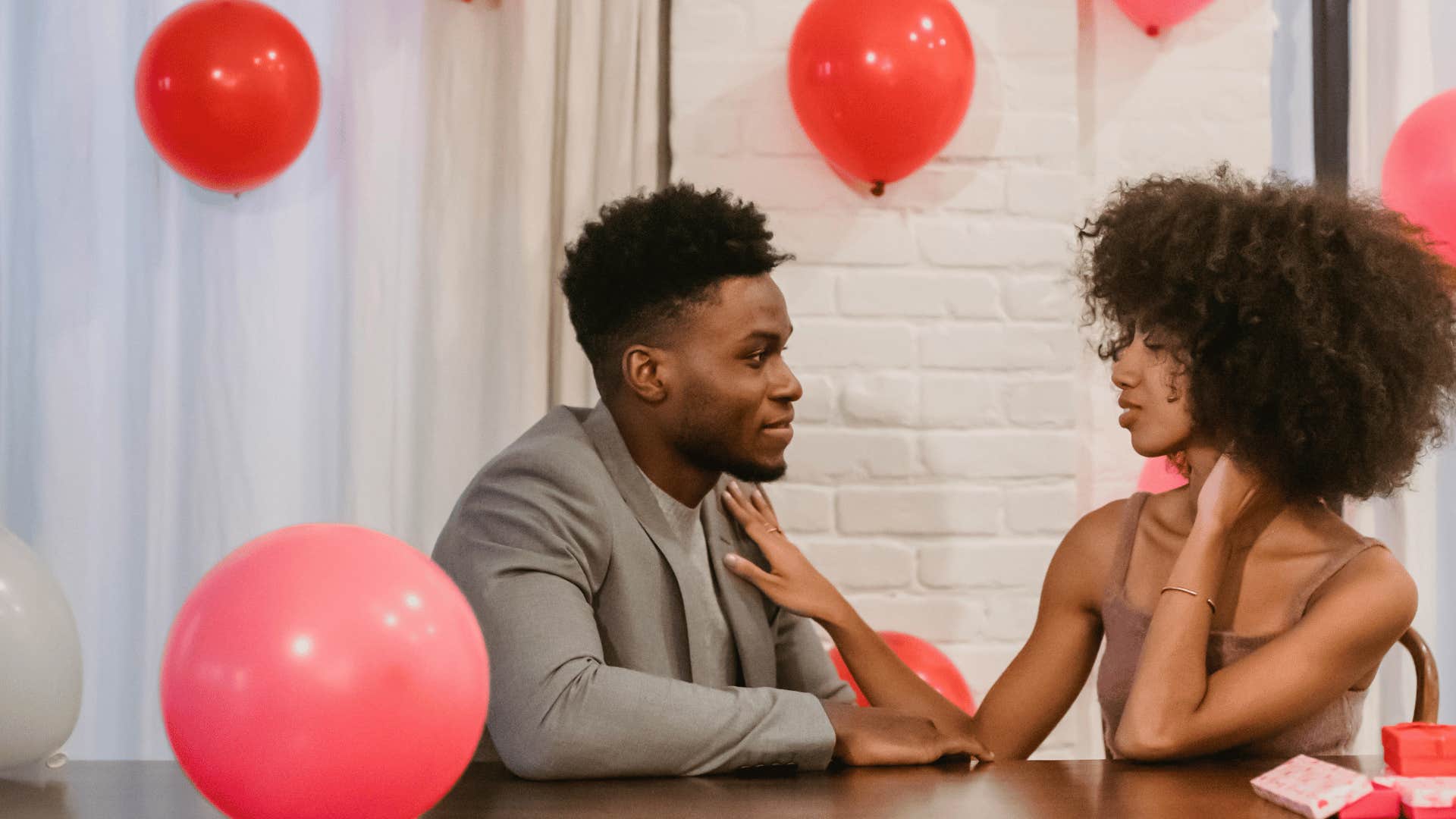 couple in love with pink balloons