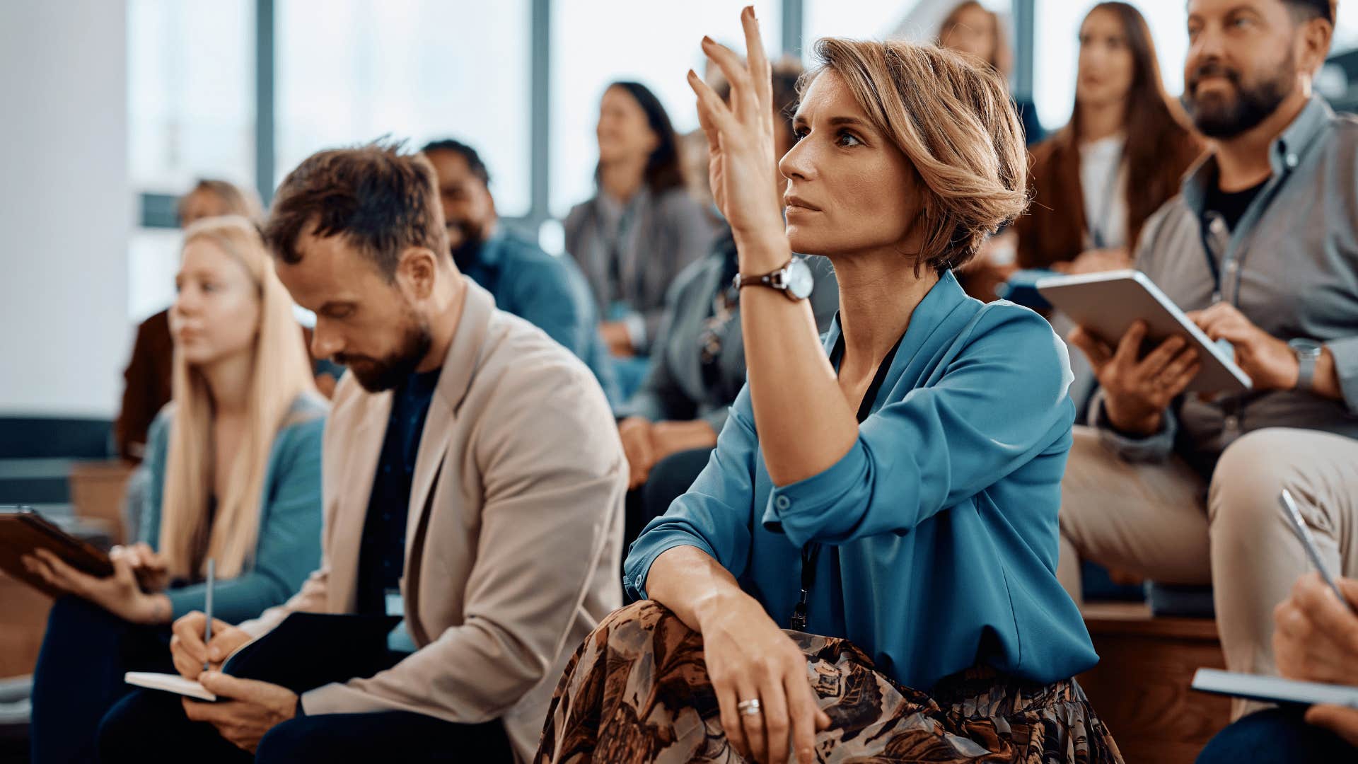 woman raising hands 