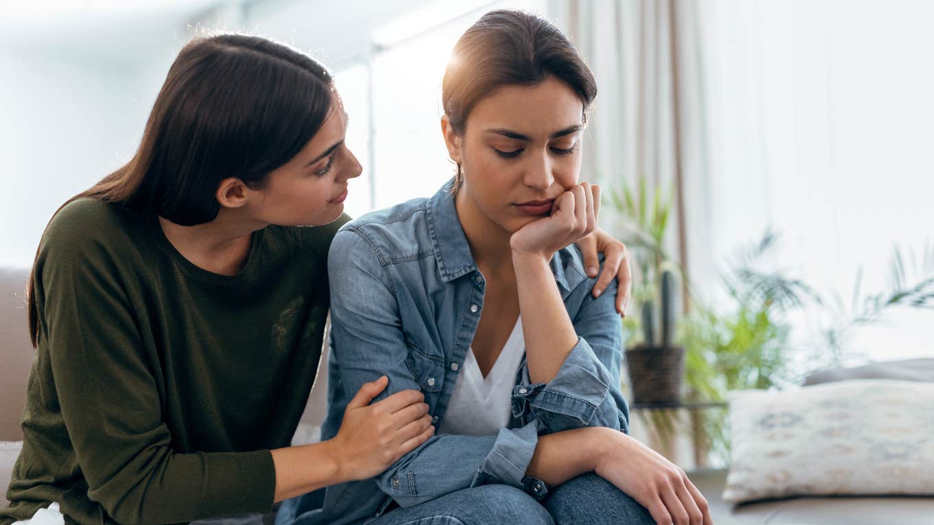 Woman comforting someone she loves who is overwhelmed